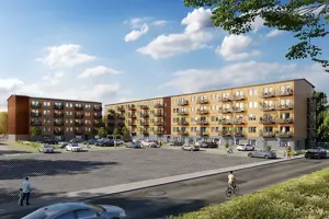 Flerbostadshus med ljusbrun träfasad, parkering framför byggnaderna | Nivika Fastigheter AB (publ)